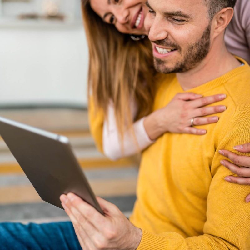 young-couple-in-love-at-home-websurfing-on-internet-1.jpg